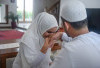 Penambahan Nama Suami di Belakang Nama Istri, Bolehkah Menurut Agama?